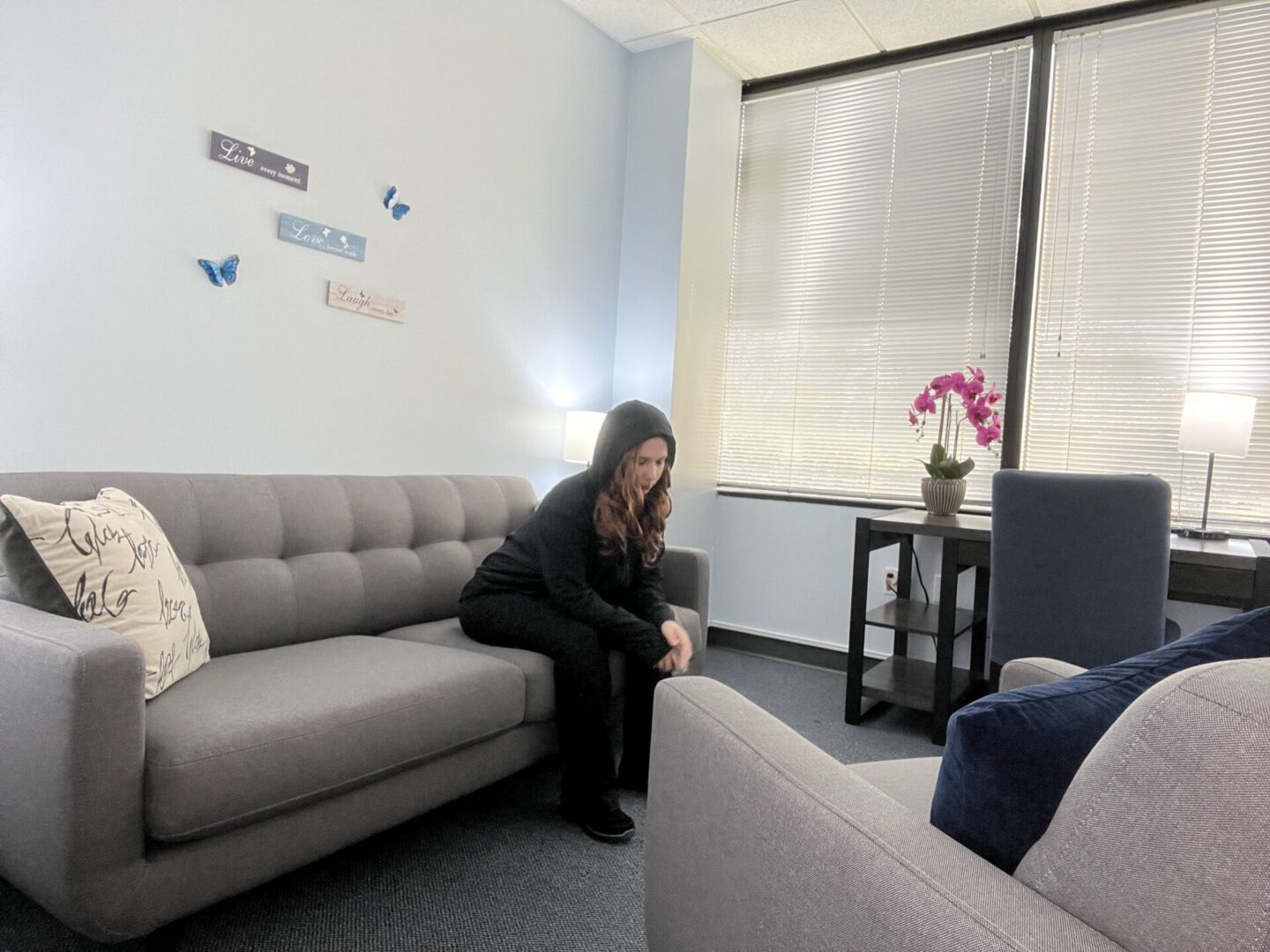 Sad Girl on Blue Couch